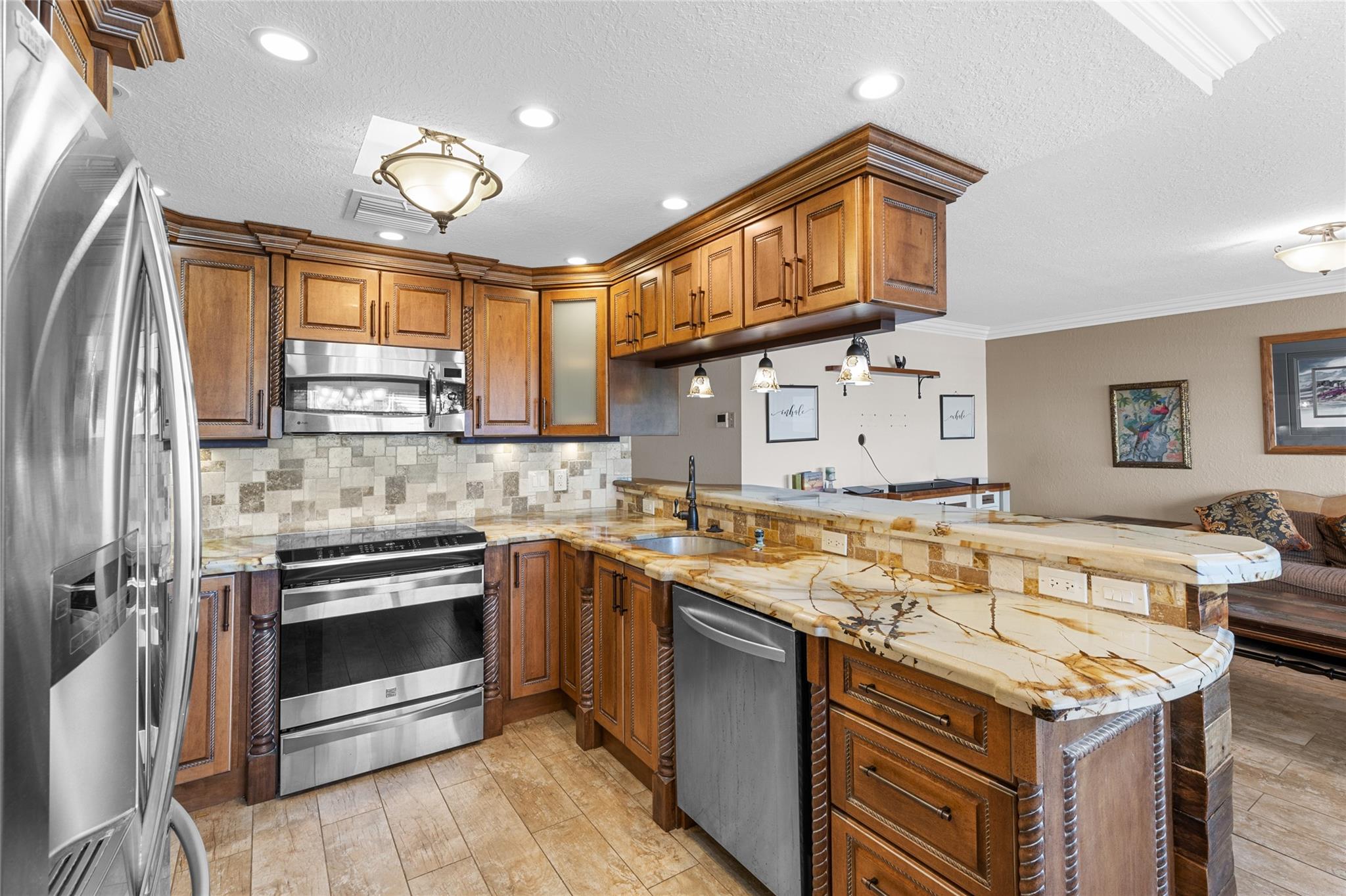 Unique opportunity to own this stunning home! Too many features to name them all, this one must be seen to be truly appreciated! Featuring high impact front windows and door, kitchen boasts all custom cabinetry, granite counters with extended island, shiplap accents, s/s appliances, recessed and pendant lighting. The bathrooms were designed for royalty with a spa-like walk-in shower accented by natural pebble stones or relax and unwind in the luxurious jacuzzi tub. All new ceramic wood plank and bamboo flooring. Additional features include a tankless water heater & newer electrical panel! Newly remodeled Olympic size pool located diagonally from the building. Century village has resort style amenities including a clubhouse, theater, pickleball, tennis, restaurant, courtesy shuttle & more!
