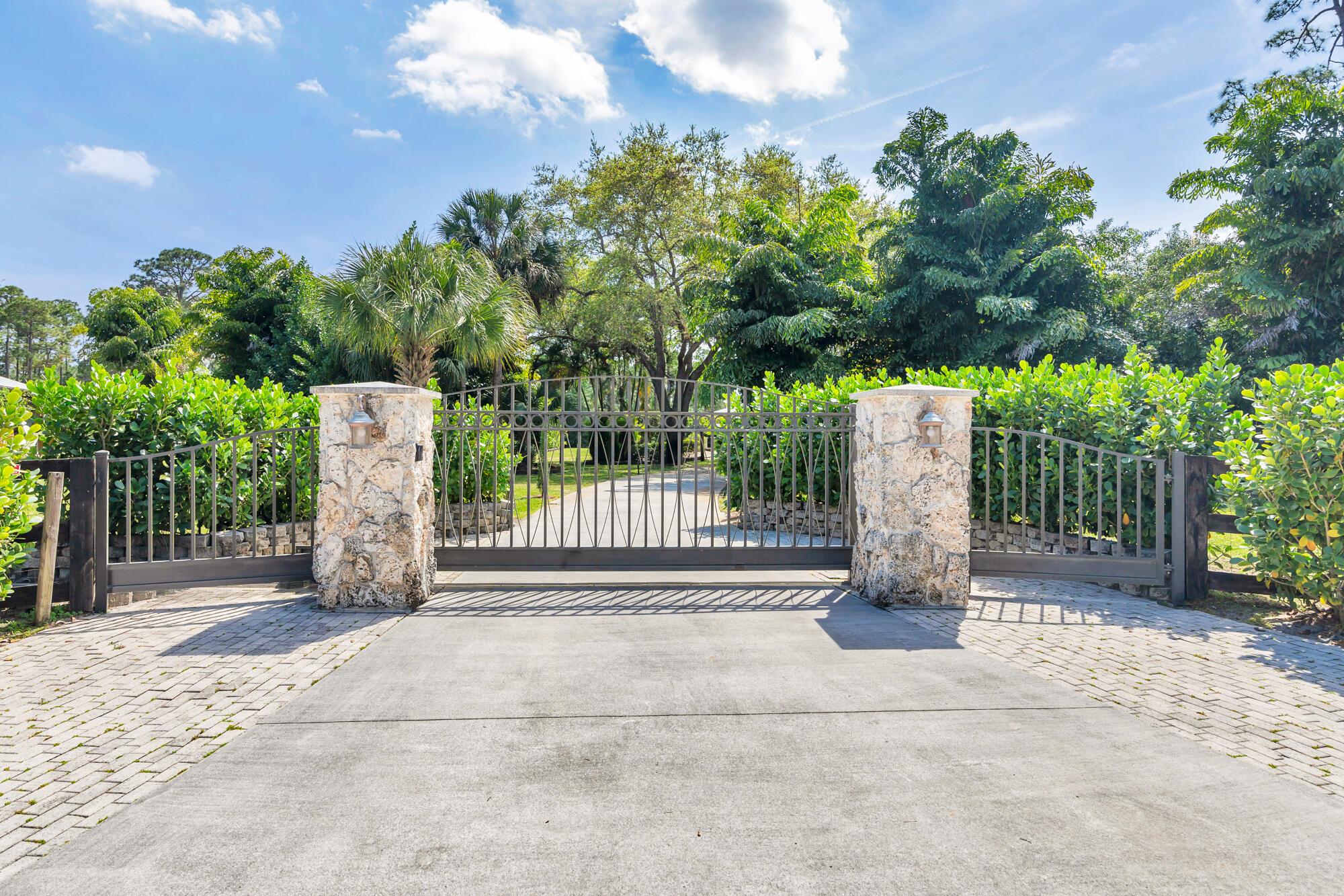 A nature lovers dream come true. This 4/3 ranch style home located in the quiet equestrian community of Caloosa, is situated on a cul-de-sac, adding extra privacy. Lush and mature landscaping greets you as you enter the fully fenced and gated property. Great room is perfect for all gatherings! Four bedrooms and three full baths. Ceramic tile though out main living area, oak wood flooring in all bedrooms.. The primary bedroom includes a walk-in closet with built ins, primary bath has a roman tub, separate shower and double vanity. Large front porch and large back patio! Entire house has hurricane impact glass windows and sliding glass door. Full house generator. Cement Paved driveway with custom gates. No horses allowed on property. Owner will allow dogs with approval. Long Term Available