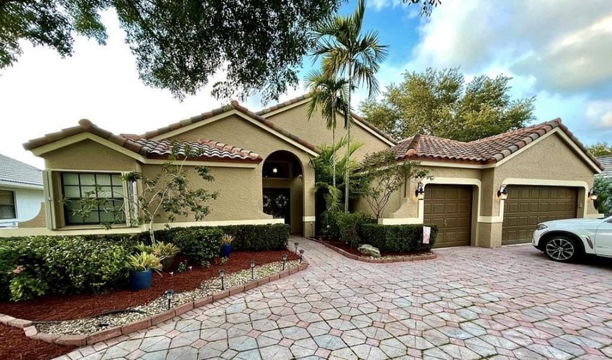 Located in prestigious Forest Ridge. Fully renovated. Over $118,000.00 in upgrades. Cream porcelain tile floors throughout the entire house. Large floor tiles (34x34). Gigantic renovated kitchen. Open floor plan. 4 bedroom / 3 bath. Huge 3 car garage. Renovated all bathrooms and main bathroom. Beautiful lake view. Huge Patio and yard. Full hurricane shutters, large circular driveway (holds 9 cars). Roof was installed in 2018. Walking distance to Tree Tops Park from neighborhood. Gorgeous community pool.