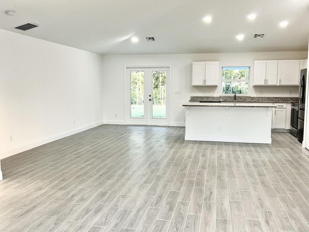 Photo of 5793 NW Coosa Drive, Port Saint Lucie, FL 34986 (MLS # R10956953)