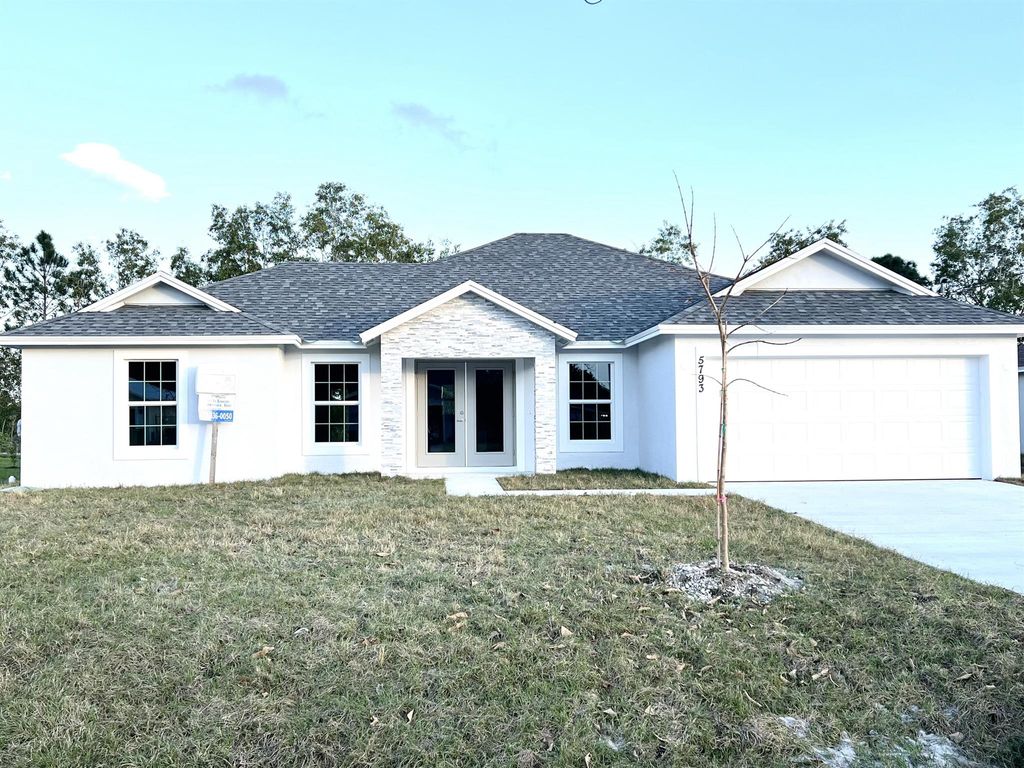 Photo of 5793 NW Coosa Drive, Port Saint Lucie, FL 34986 (MLS # R10956953)