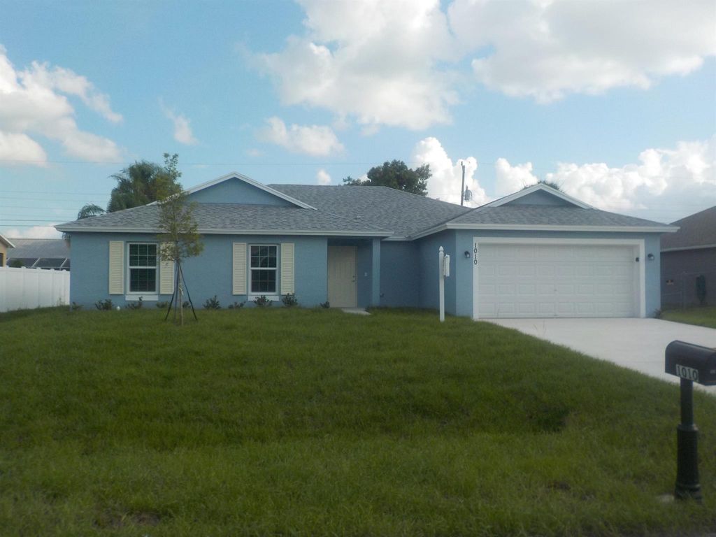 Photo of 1010 SW Calmar Avenue, Port St Lucie, FL 34953 (MLS # R10906422)