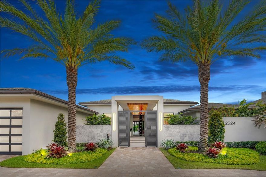 Iconic luxury living awaits in this exquisite home in the exclusive gated community of The Enclave with only 36 sites. The front gate opens to a walnut-covered breezeway that leads to the front foyer-a perfect welcome that will impress every guest. Soaring Ceilings, high-line windows, & a modern chandelier illuminate the great room. From here, you can flow into the gourmet kitchen or out to the lanai, where you can enjoy views of the Spa & Pool and the Rees Jones Golf Course. This gorgeous home with 4BR 4BA w 2 Half BA is impeccably appointed, including an office, soundproof media room, separate formal dining room, 3-car garage, & golf cart bay.   The Primary Suite is a work of art offering 2 walk-in closets & free-standing bathtub with a large spa shower that opens to a private courtyard.