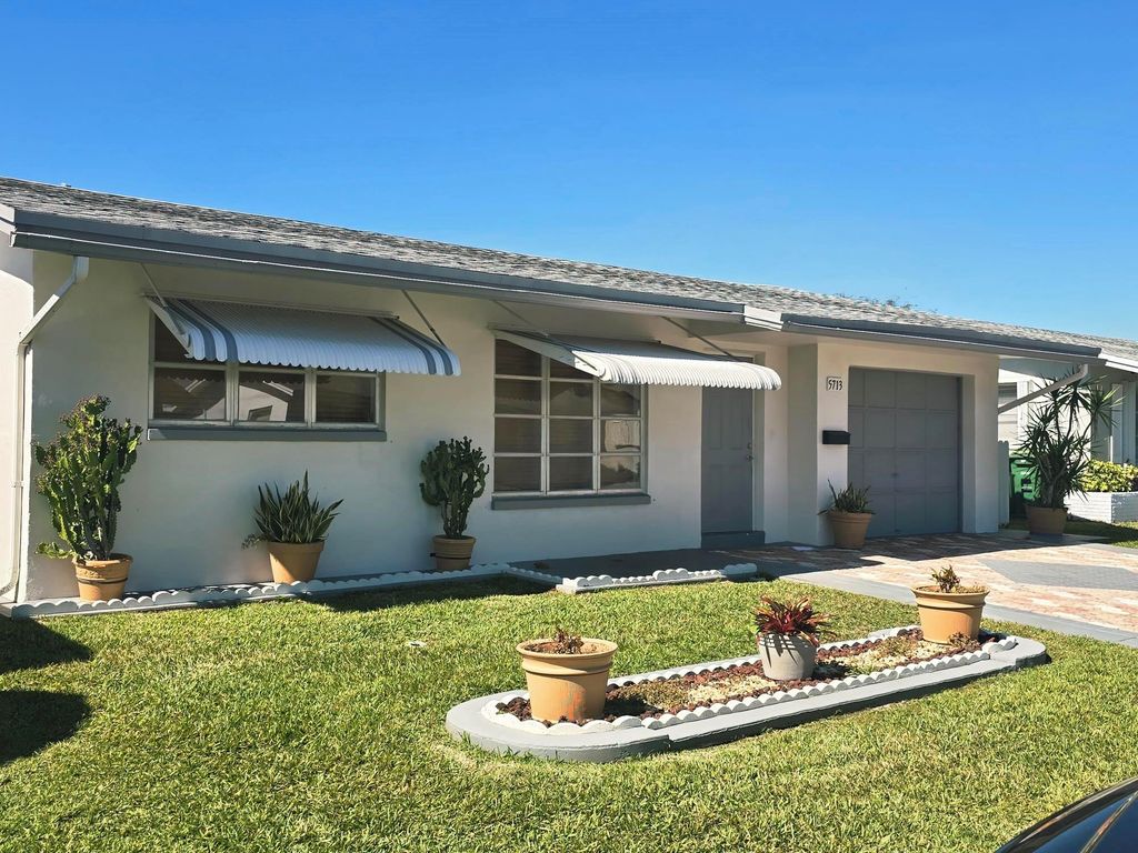 Photo of 5713 NW 65th Te Ter, Tamarac, FL 33321 (MLS # F10547953)