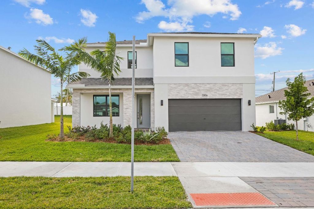 Photo of 2006 NE Ocean Dunes Drive, Jensen Beach, FL 34957 (MLS # R10947611)