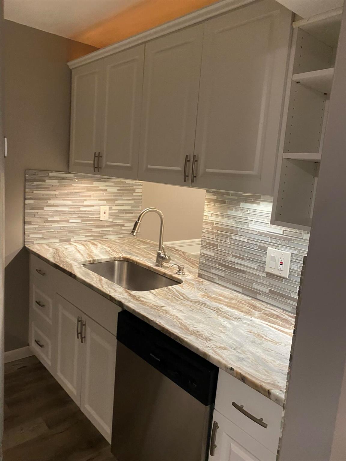Beautifully updated two-bedroom two bath first floor unit., assign parking spots, community pool. Centrally located.