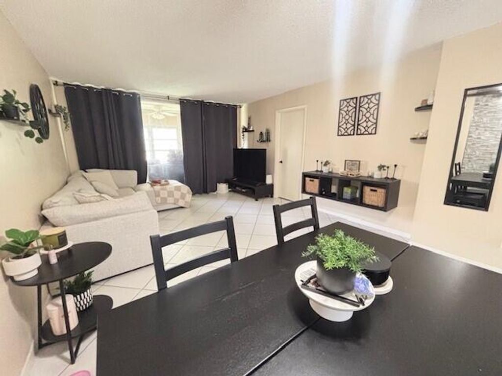 Photo of 6161 NW 57th Court #103, Tamarac, FL 33319 (MLS # B26003249)