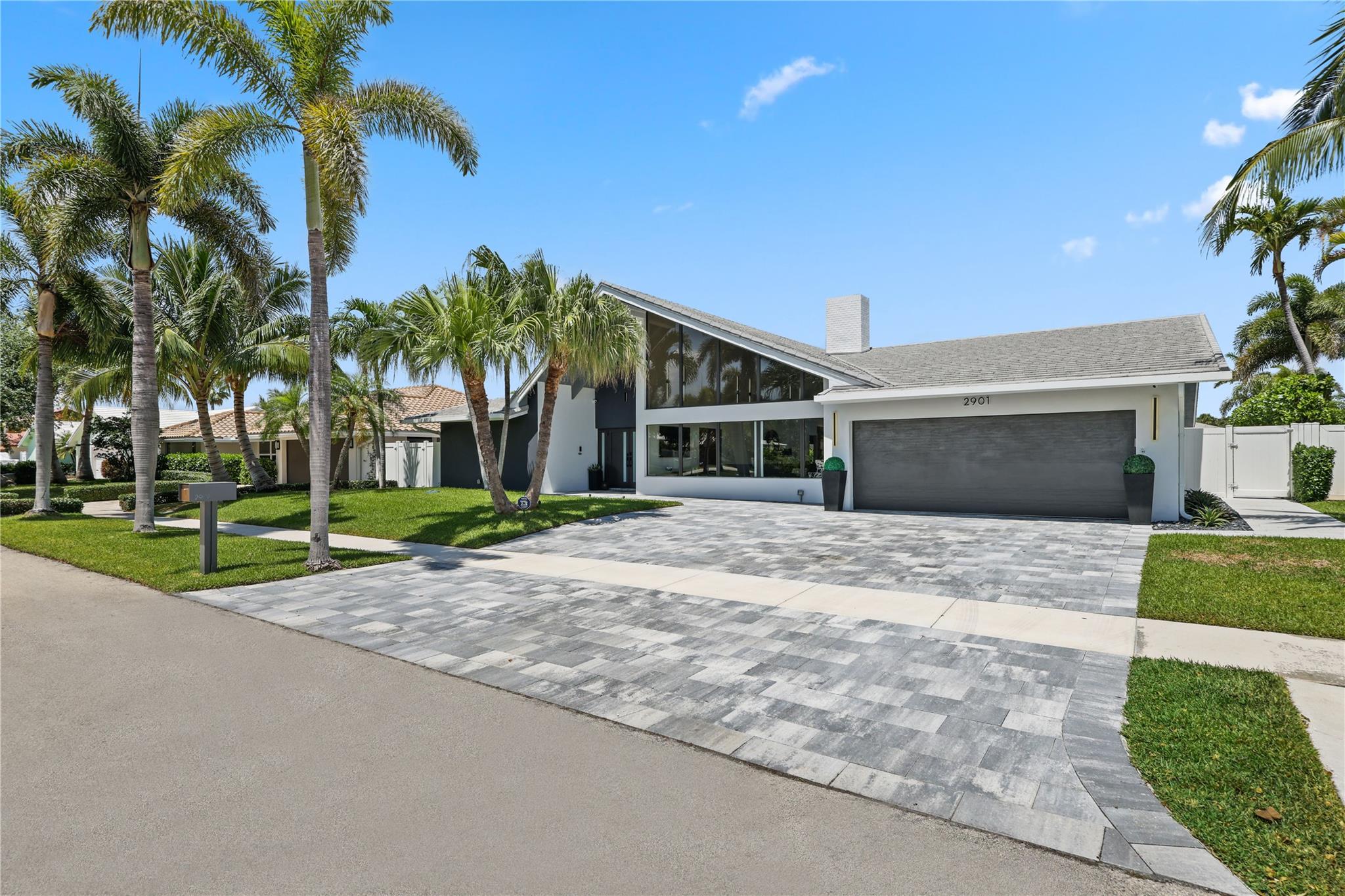 Experience the pinnacle of South Florida waterfront living in this fully renovated masterpiece. Every inch of this residence has been thoughtfully reimagined, blending modern sophistication with upscale coastal living. Soaring ceilings, oversized tile flooring, and expansive windows fill the home with natural light. The open living area flows seamlessly outdoors, and the chef’s kitchen, overlooking the Intracoastal, features Bosch appliances and a 48” built-in JennAir fridge. Outside, enjoy a sleek modern pool and 85 ft of deepwater frontage with a private dock and direct ocean access. With smart home technology, a full-house gas generator, impact windows, and brand-new systems throughout, every detail has been thoughtfully curated for comfort, convenience, and elevated living.