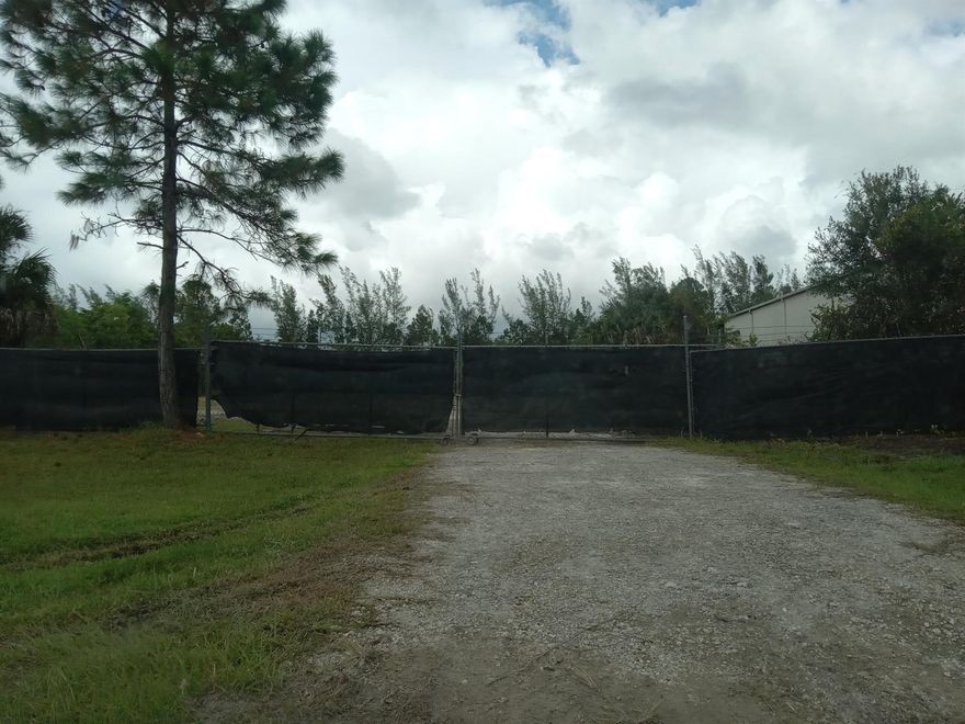 : Vacant Industrial lot in Palm Beach Commerce Park. 1 acre fully fenced, cleared, and ready for rental. This would be great for a private warehouse, storage, business, etc. Zoning is PIPD, which allows light industrial. There are several established businesses in the park now. Including Walgreens Distribution Center, Verizon, Moving & Storage, Marine/Boat Building, FPL, Distributions, etc. Commerce Park is located off of Pratt Whitney Rd between Indiantown Rd. and Beeline Highway. Turn on to Corporate Rd N from Pratt Whitney Rd then turn left on Assembly Loop.