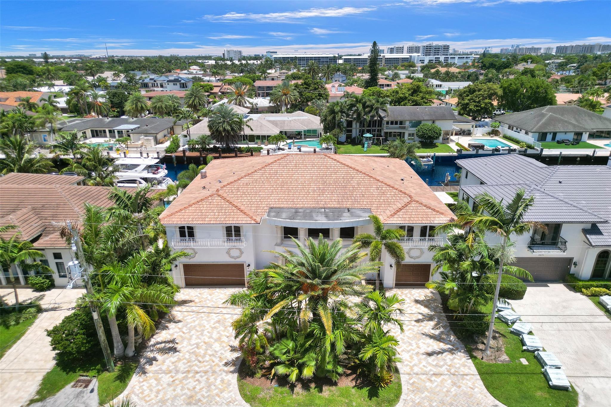 Stunning 5-bedroom, 6,195 sq ft, 85 waterfront home with deep water and unobstructed ocean access. Built in 2008, this estate features 2 primary suites, 2 additional bedrooms on the first floor, a convenient elevator, and 2 laundry rooms. The gourmet kitchen boasts a Sub-Zero side-by-side refrigerator/freezer, a Wolf gas cooktop, and a double oven. Enjoy the heated pool with a spillover spa and a fenced backyard for ultimate privacy and relaxation. A spacious 3-bay garage completes this luxurious residence, available as an unfurnished annual rental for $27,500 per month. Don’t miss out on this exquisite waterfront living opportunity! Property is also for sale.