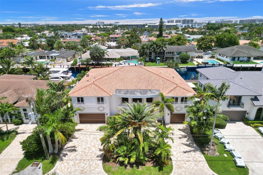Stunning 5-bedroom, 6,195 sq ft, 85 waterfront home with deep water and unobstructed ocean access. Built in 2008, this estate features 2 primary suites, 2 additional bedrooms on the first floor, a convenient elevator, and 2 laundry rooms. The gourmet kitchen boasts a Sub-Zero side-by-side refrigerator/freezer, a Wolf gas cooktop, and a double oven. Enjoy the heated pool with a spillover spa and a fenced backyard for ultimate privacy and relaxation. A spacious 3-bay garage completes this luxurious residence, available as an unfurnished annual rental for $27,500 per month. Don’t miss out on this exquisite waterfront living opportunity! Property is also for sale.