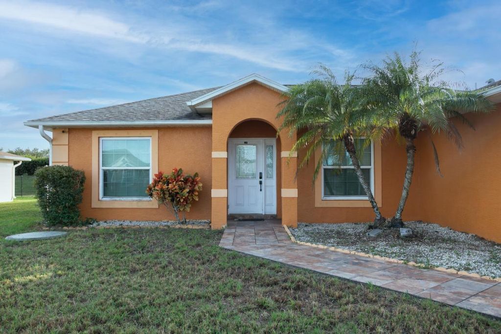Photo of 594 SW Grove Avenue, Port Saint Lucie, FL 34983 (MLS # R11140864)