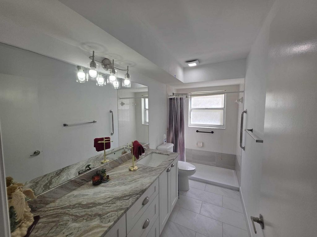 Photo of 6201 Pond Tree Court, Greenacres, FL 33463 (MLS # B26026459)