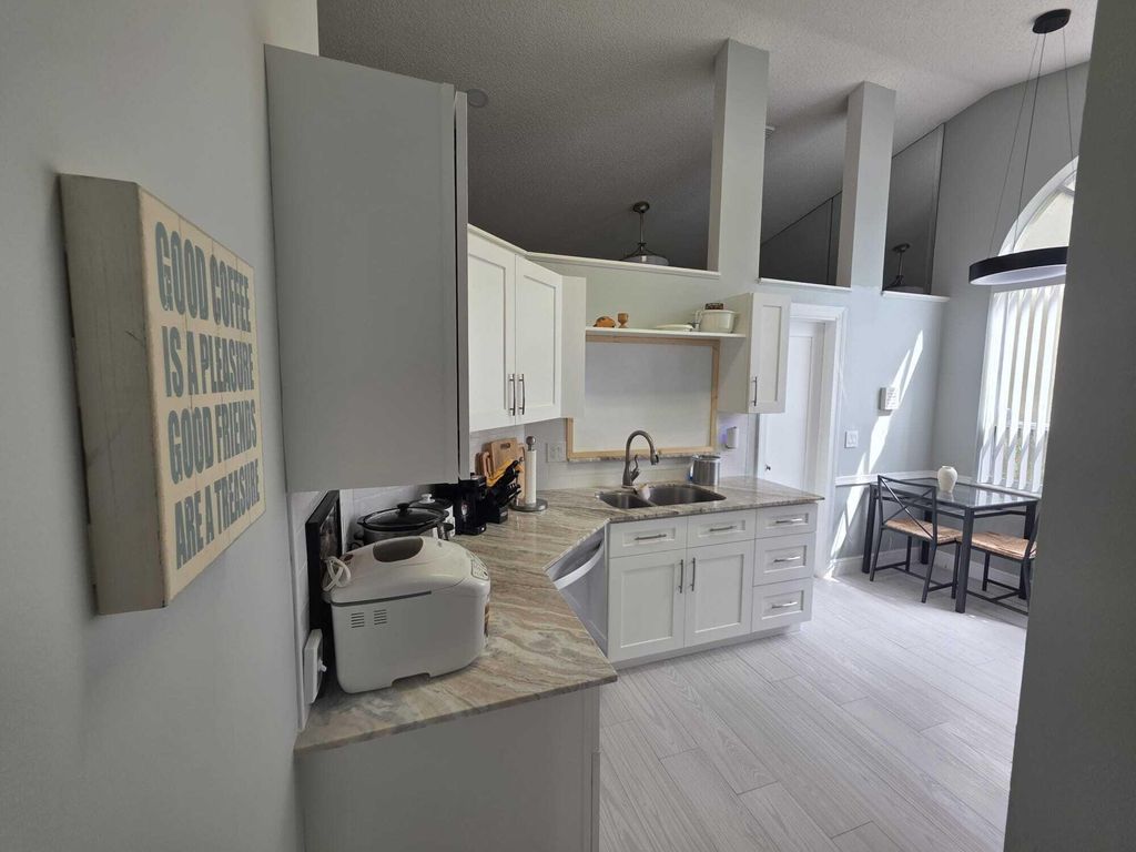 Photo of 6201 Pond Tree Court, Greenacres, FL 33463 (MLS # B26026459)