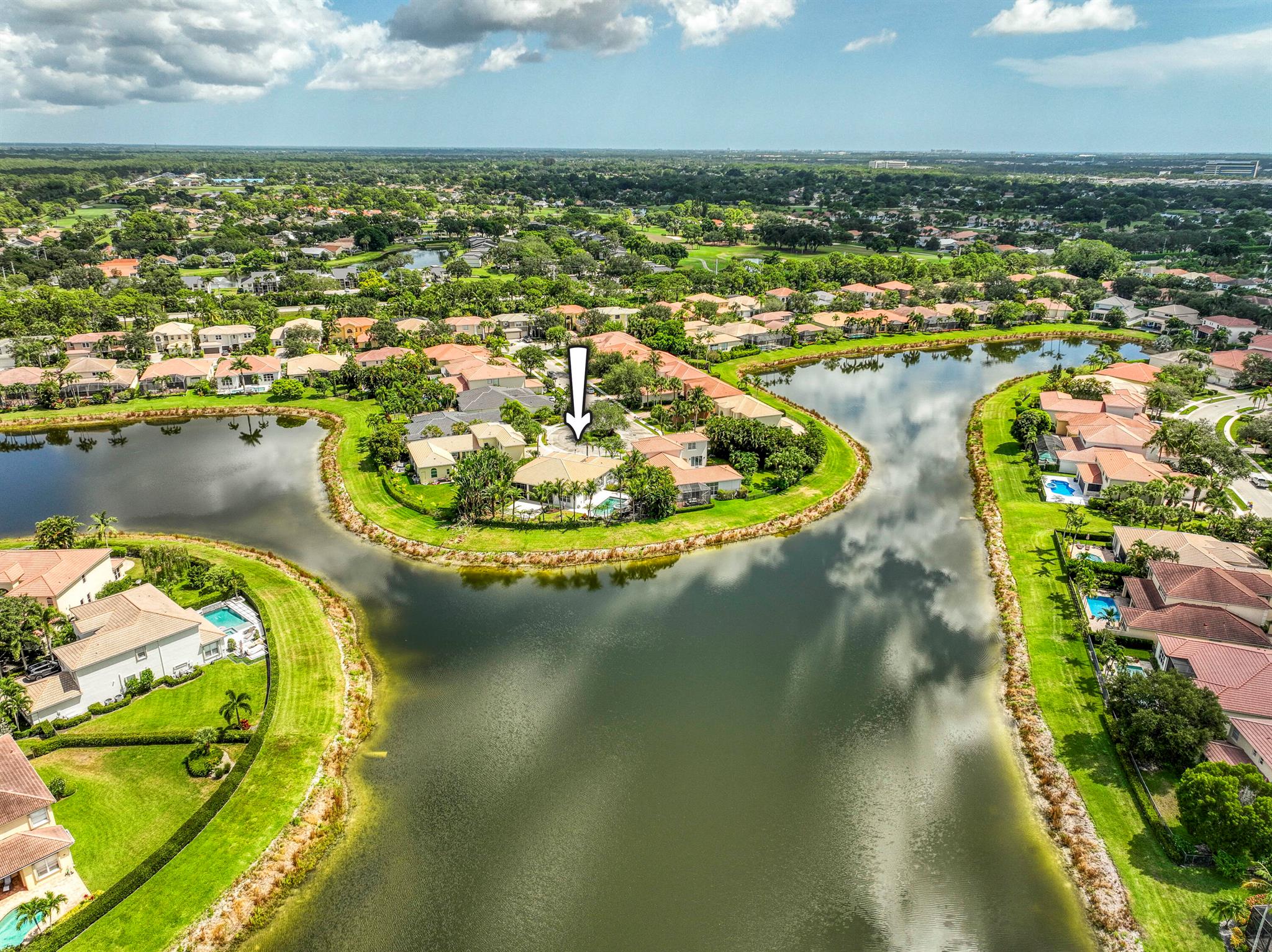 Best Lot in Mirabella! Tucked at the end of a quiet cul-de-sac, this beautifully maintained one-story CBS home blends comfort, privacy, and Florida charm. Offering 4 bedrooms, 2.5 baths, and a 2-car garage across 2,695 sq ft on an oversized 11,761 sq ft lot, the home is enhanced with a whole-house gas generator and storm protection including electric and accordion shutters. Step inside to a bright, open living room featuring stone-look ceramic tile and a wall of sliding glass doors framing serene backyard views. The formal dining room is tucked into a cozy corner with a sweeping curved window and ample wall space, perfect for hosting memorable gatherings. The spacious kitchen is designed for both function and style, with a large island featuring pull-up seating, a coffee/wine bar niche,