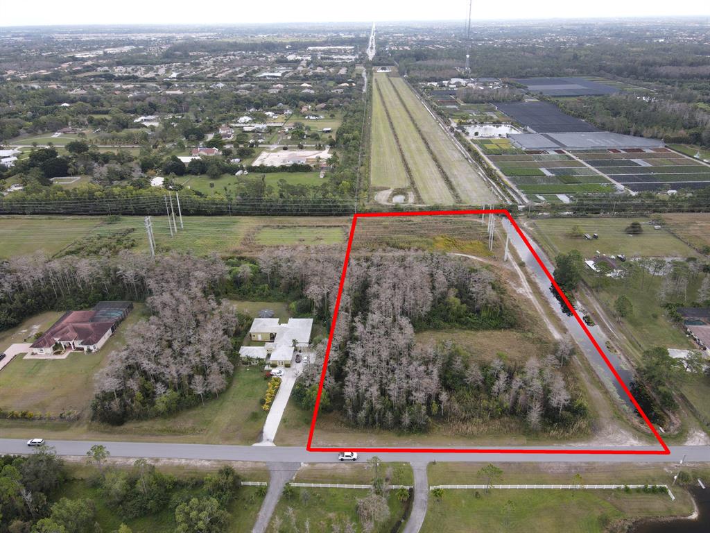 Here's the chance to build your custom dream home! Prime 5-acre waterfront lot situated in the highly desirable gated community of Homeland. Envision your equestrian estate on this lot with plenty of land to build horse stables, paddocks, jumping rings, and much more. This established community is conveniently located just minutes away from Wellington's equestrian venues, A-rated schools, shopping, fine dining, easy access to major highways and airports, and offers 20 miles of riding trails. This spacious lot delivers the benefits of life on a private street while remaining in the city!