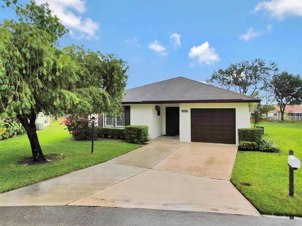 Photo of 6349 Tall Cypress Circle Cir, Green Acres, FL 33463 (MLS # R10724375)