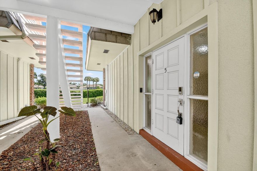 This updated first-floor condo combines comfort, security, and smart design. Featuring newer Washer/Dryer, HVAC, a fully upgraded kitchen, smart home features, and a well-laid-out split floor plan, the space offers seamless indoor-outdoor living with serene golf course views. Enjoy partial hurricane protection, higher elevation, and private parking plus ample guest spots. Northern exposure brings energy efficiency and soft light year-round. HOA includes roof, building insurance, and well-kept common areas, offering excellent value. With ground-level access, modern systems, and a peaceful setting, this home blends lifestyle and practicality in one of Palm Beach County's most desirable communities. Here's your chance to embrace the relaxed, upscale lifestyle that Atlantis offers