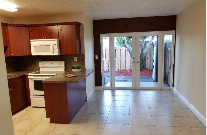 Updated corner unit ready for its next tenant! Located near I-595, BCC, Nova, and FAU campuses, it’s perfect for students, roommates. A closet under the stairs is set up as a server room. Flooring includes tile downstairs and. Bedrooms are spacious with deep closets, and bathrooms have been updated with modern vessel sinks. There’s also an outdoor utility closet with washer/dryer hookups.