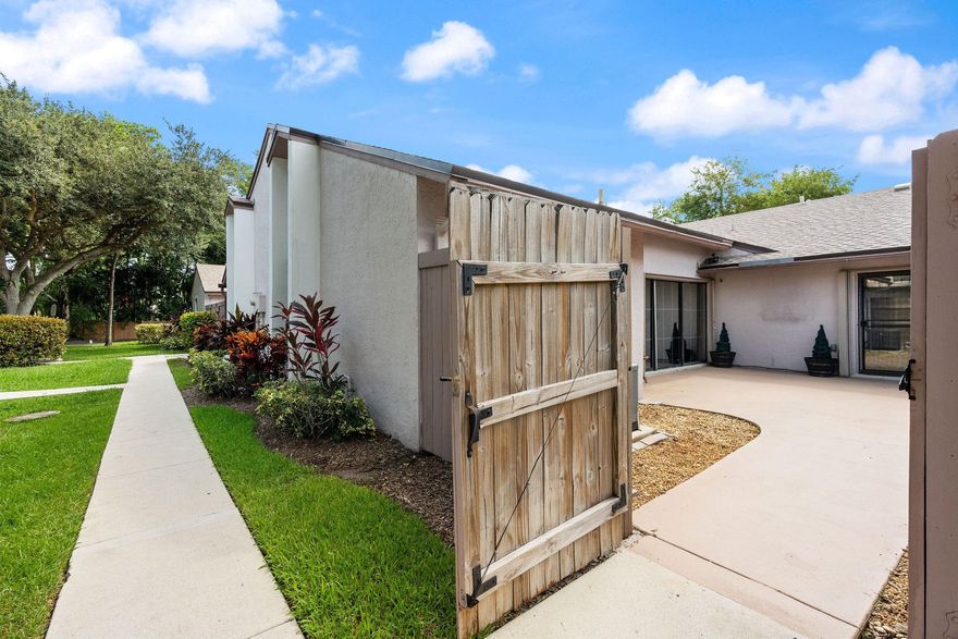 ***WELCOME TO THE COURTYARDS OF PLANTATION!!!***BEAUTIFULLY UPGRADED 2 BEDROOM, 2 BATHROOM VILLA IN THIS EXCLUSIVE NEIGHBORHOOD! THE OPEN FLOOR PLAN WITH ABUNDANT NATURAL LIGHT GREETS YOU AS YOU ENTER AND VAULTED CEILINGS PITCHED UP TO 11-FT AWAIT. BEAUTIFUL GOURMET KITCHEN WITH WOOD CABINETS, GRANITE, NEWER SS APPLIANCES! NEW WOOD-LOOK PORCELAIN TILE THROUGHOUT THE ENTIRE HOME. THE SPACIOUS PRIMARY SUITE IS COMPLETE WITH A WALK-IN CLOSET AND AN UPGRADED BATHROOM. ENJOY PRIVATE FENCED PATIO TO RELAX & ENTERTAIN (PAINTED 2025)! NEW ROOF (2019), AC (2022), DISHWASHER (2024), TANKLESS WATER HEATER, FULL ACCORDION SHUTTERS, EXTRA STORAGE, AND 2 PARKING SPACES. HOA COVERS ROOF, LAWN, TRASH, & POOL. HOME IS FHA APPROVED AND QUALIFIES FOR ASSUMABLE 4.5% FHA LOAN!--CALL FOR DETAILS!