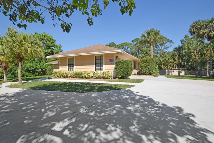 An amazing family opportunity in Palm Beach Gardens!  This spectacular 3Bdr and 2 Bath home has so much to offer you. A few of the features include: Large bedrooms with a split plan design, a 2 car garage and an extended driveway ( for RV or Boats), stylish wood like flooring, an eat in kitchen with newer appliances and granite counters looking over the pool and patio with a screened lanai, then heading outside there is an abundance of tropical landscaping a large deck with pool and outdoor recreation area for all ages, fenced back yard, and not to mention paved roads with city water!
Pride of ownership and so much for your family. See it soon.