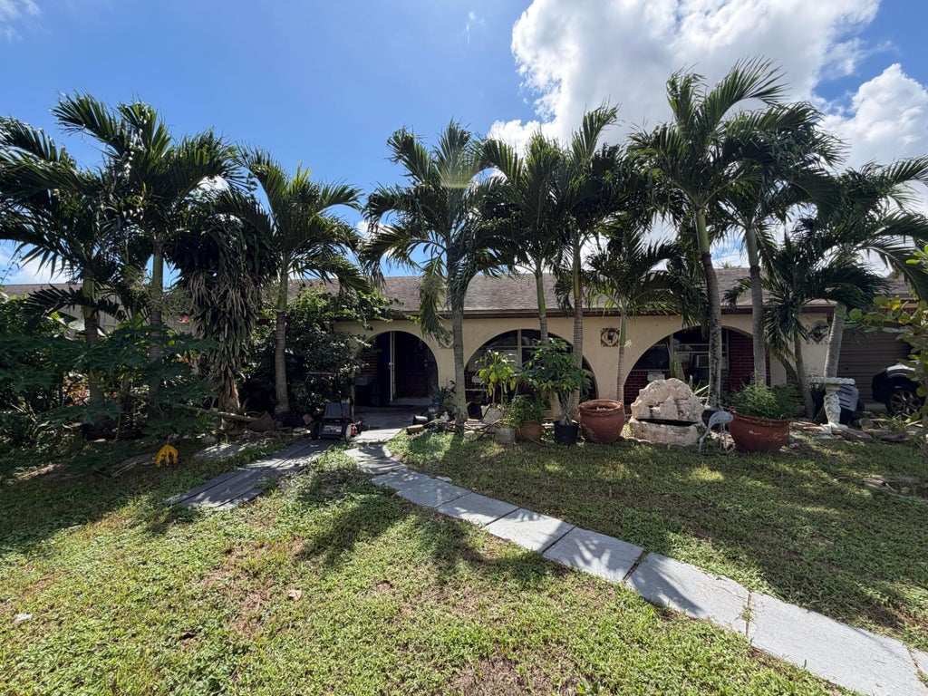 Photo of 3464 ARTESIAN Drive, Lake Worth, FL 33462 (MLS # B26086737)
