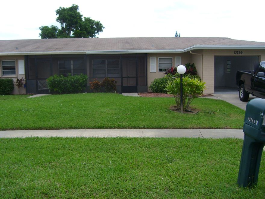 Updated beautiful end unit with lake view next to community pool. Screened front porch and back patio.  Active club house in well kept community.