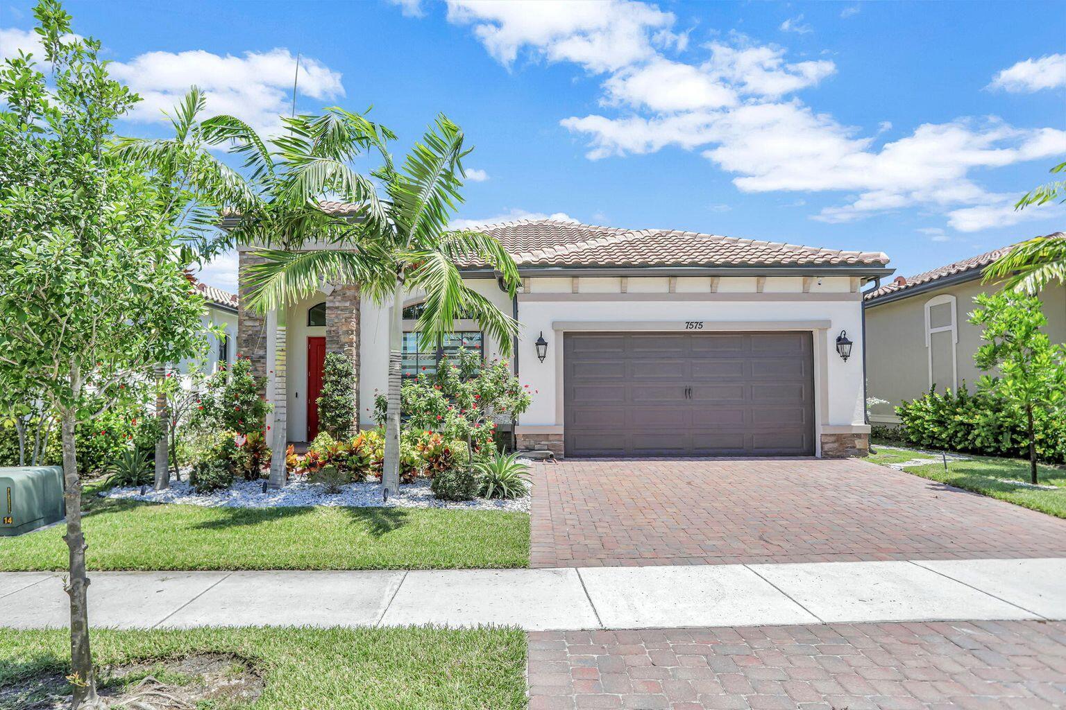 The Falls is a new luxury active lifestyle (55+) community in prestigious Parkland featuring a 24,000sqft clubhouse w extensive amenities. This popular Antigua Grande Model boasts 2BR+Office which can be Converted to a 3rd Bedroom. Spanish Elevation, Kitchen w Tall white Wood Double Stacked Cabinetry, Modern Quartz Countertops, French Door Ref & Gas Cooktop, Large Island enhanced w/ Wood finish & huge Walk-In Pantry, Laundry complete w Cabinetry, Quartz Top, new W&D , Large covered Lanai w/ Extended Paver Patio with new enclosure and fenced backyard & tropical lush landscape. Oversized Island & Natural Gas Cooktop, Spacious Owners Suite & Bath W/Shower, High CeilingsOver $75,000 in Builder Upgrades: Outside Brick Package on front exterior, Porcelain Tile throughout entire house,