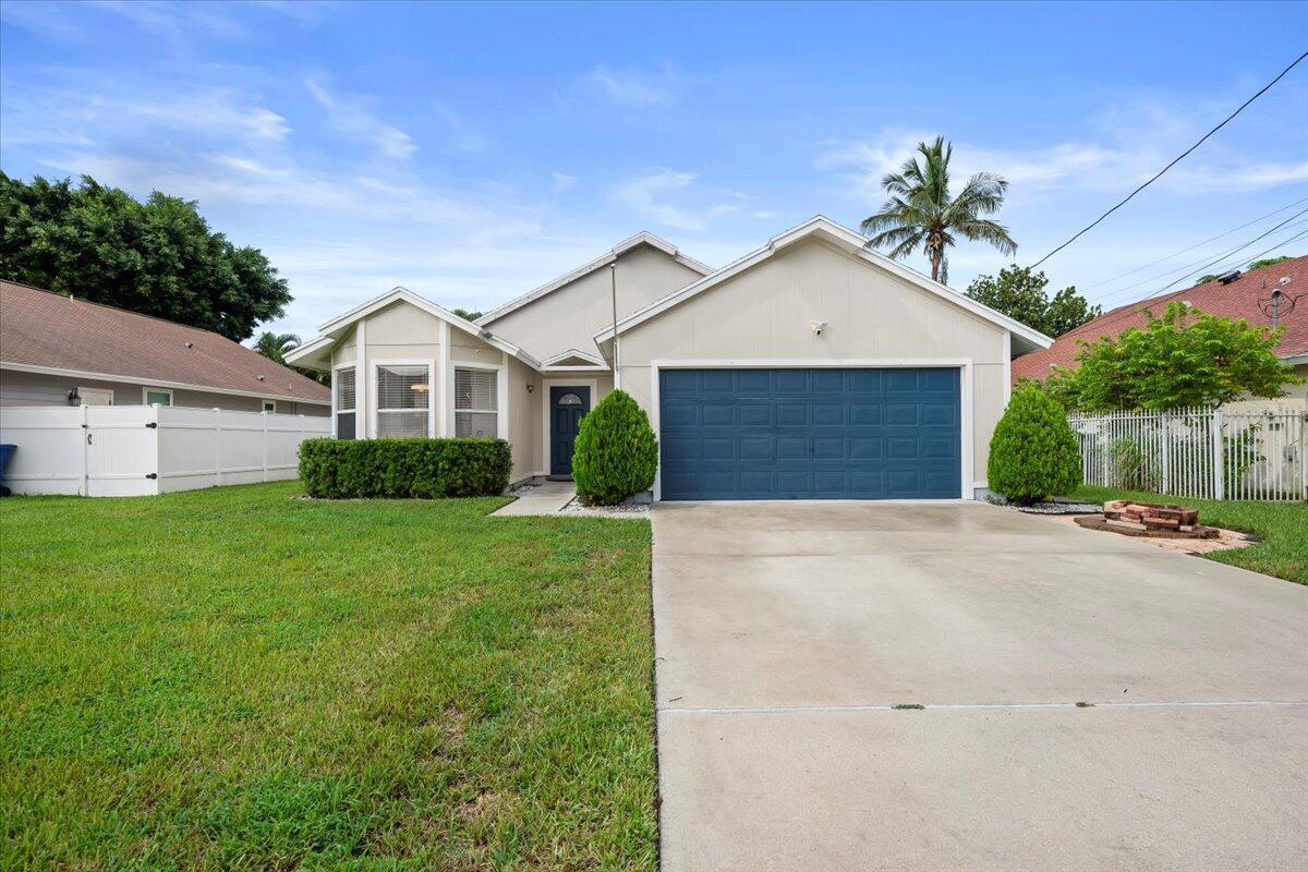 Beautifully renovated and tucked into one of Jupiter's most desirable neighborhoods - without the hassle of an HOA! This single-story gem offers 3 bd/2 ba, plus a versatile den. The oversized kitchen is a true showstopper, featuring crisp white cabinets, SS appliances, and a sleek quartz countertop. High-quality flooring runs throughout the home, tying the spaces together with a clean, stylish finish. The primary suite features a custom bathroom with a dramatic black marble shower with elegant gold accents, while the updated second bathroom offers a sleek, contemporary design. With a NEW ROOF in 2020, and a prime location just minutes from beaches, A-rated schools, shopping, dining, and I-95, this home is move in ready and perfectly situated for enjoying the best of Jupiter living!