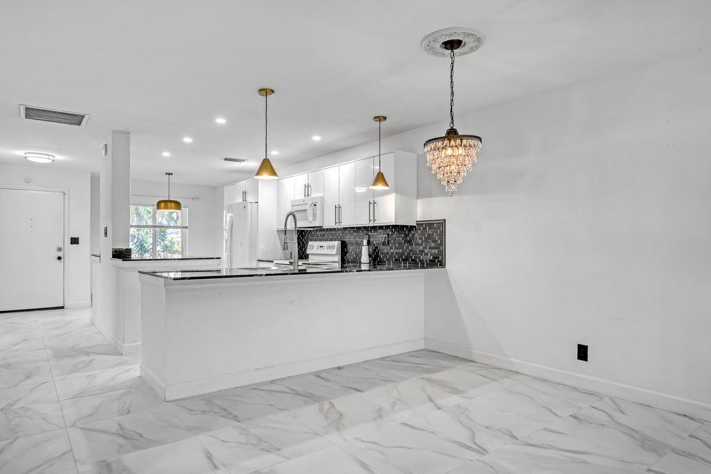 Photo of 13233 Lucinda Palm Court #B, Delray Beach, FL 33484 (MLS # B26066316)