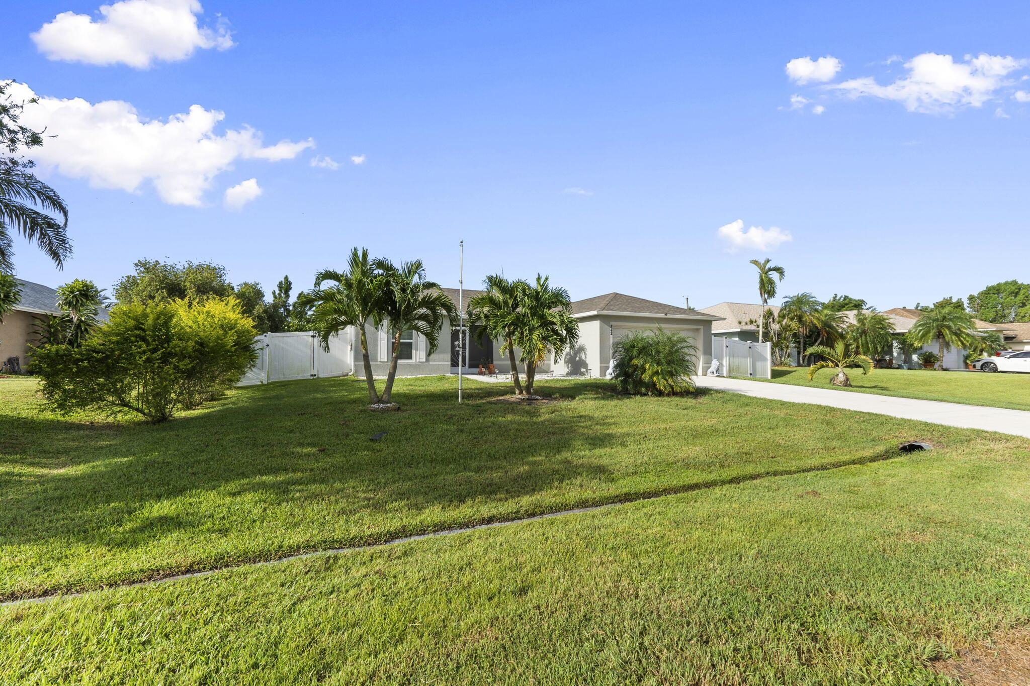 Immaculate 2021 CBS 3-bedroom, 2-bath, 2-car garage home in a prime Port Saint Lucie location! This move-in ready gem features stunning travertine flooring, a spacious open layout, and a fully fenced backyarda"perfect for pets, play, or entertaining. The split-bedroom floorplan offers privacy, while the modern kitchen and bathrooms reflect pride of ownership throughout. Located in a quiet, desirable neighborhood close to shopping, dining, parks, and I-95. No HOA! Whether you're a first-time buyer, downsizer, or investor, this home checks all the boxes. Don't miss your chance to own a like-new home without the wait!