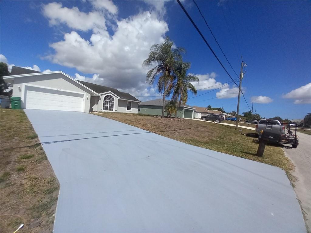 Photo of 687 SW Nichols Ter, Port Saint Lucie, FL 34953 (MLS # F10320930)