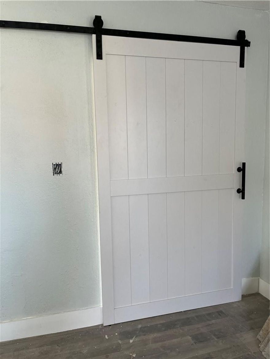 Completely Remodeled 3/1 into a Chic Modern Farmhouse Home. Gorgeous Black & White Detailing throughout including a Large Barn Door that leads into Master Bedroom.Enjoy an open concept design with gorgeous wood laminate flooring throughout.Brand new Kitchen, featuring white cabinets, an island facing the dining room, with gorgeous quartz countertops and backsplash.Bathroom was redesigned and features mosaic tile, with gorgeous navy blue and gold accent detailing.This gorgeous home sits on a corner lot near 95 and the turnpike.***Enjoy: Brand NEW Roof & Impact Windows. Titan Water Heater. Central A/C. Freshly Painted Texturized Walls. Laminate Wood Flooring. Newly Designed Bathroom. Newly Designed Kitchen. Stainless Steel Appliances.