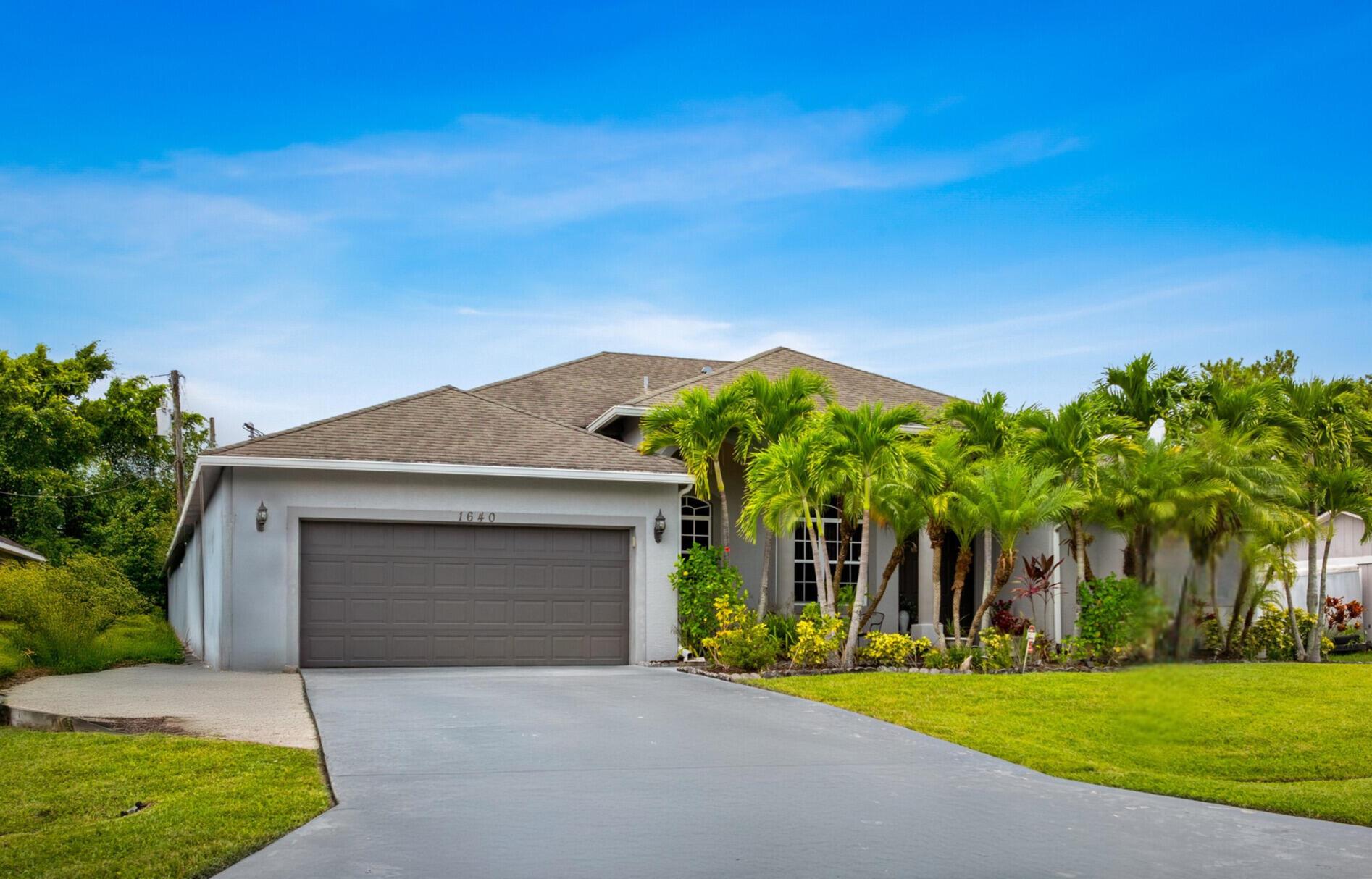 Welcome to this beautifully maintained 4-bedroom 3-bathroom home featuring a split floor plan and a spacious 2 car garage. The master suite is a true retreat, complete with a generous walk-in closet, a large bathroom offering a separate shower and soaking tub, and a private office space perfect for remote work or relaxation. Enjoy entertaining in the formal dining room and large living area, or gather in the oversized kitchen and eat in area. Ideal for everyday meals and hosting. Step outside to a covered patio overlooking a fenced backyard with a storage shed for added convenience. Located just minutes from both I-95 and the Florida Turnpike, this home offers easy access for commuting while still providing a quiet comfortable lifestyle.