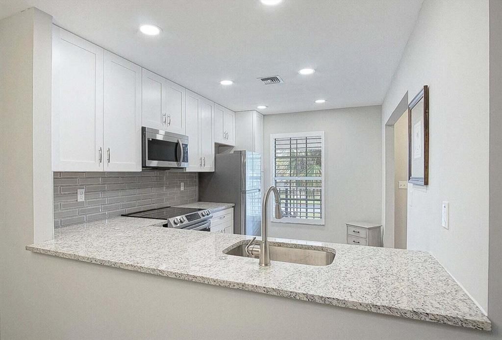 Photo of 1219 S Lakes End Drive #E-2, Fort Pierce, FL 34982 (MLS # R10864919)