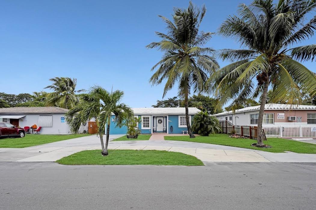 A charming 3 bed/3 bath single family home in the heart of Hollywood, one of the highlights being the huge Florida room that leads to a beautiful backyard, featuring a large pool, perfect for cooling off on hot summer days. The living room/kitchen is open plan and flooded with light. One of the bedrooms can be used as an income producing unit or as a home office/studio (it has been a successful AirBnB in the past). Improvements include: the house is freshly painted, repaired/repainted fence around the house, new walkway on the side, a water filtration system and termite bait stations throughout the property. There is a large storage shed and regular storage shed. Flat roof 2025. Tile Roof: 2010. AC 2010. Only 7 minutes to the beach. Close to shopping, Dania Pointe or Aventura Mall.