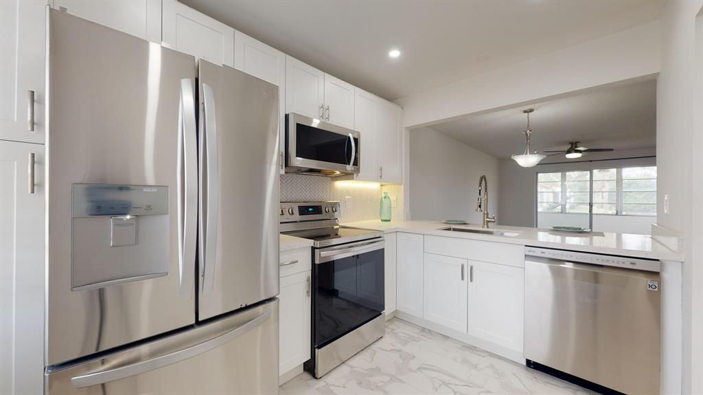 Photo of 305 Lake Carol Drive, West Palm Beach, FL 33411 (MLS # R10687460)