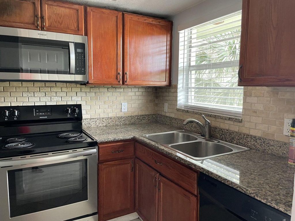 Photo of 1638 Embassy Drive #305, West Palm Beach, FL 33401 (MLS # R10973786)