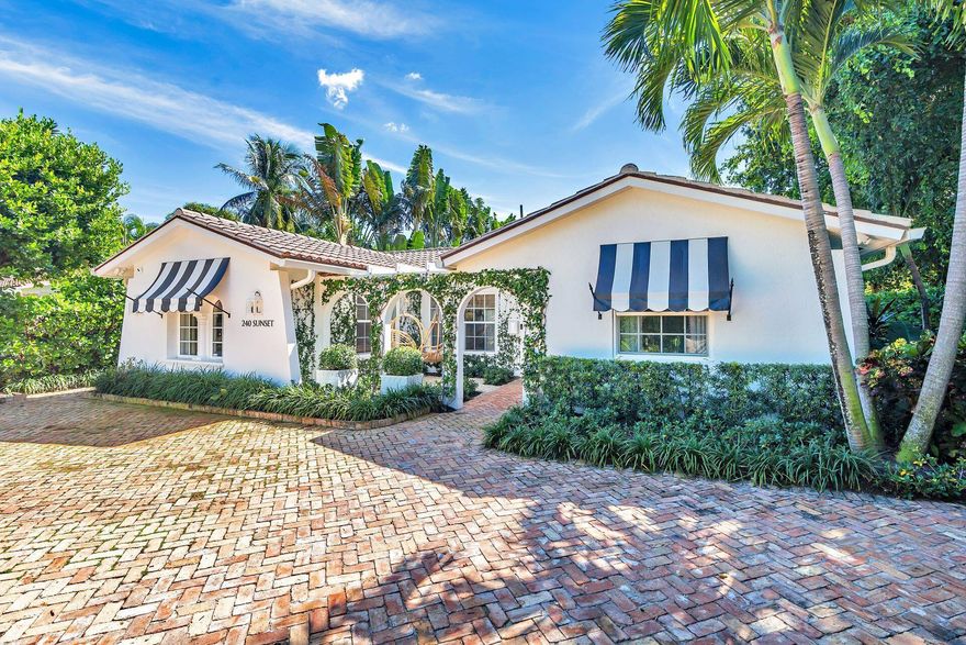 On an intracoastal block in the heart of El Cid, this 4-bedroom jewel box is fully renovated and reimagined by interior designer, Jessica Joern Cunningham. Inside, high vaulted ceilings adorn the living room. The kitchen features top of the line appliances including a La Cornue gas range. The dining room has floor-to-ceiling glass doors leading to a covered loggia with outdoor dining and entertaining space. The primary bedroom also accesses the loggia and features a sitting room, dual closets, and large ensuite bathroom. Outside is an expansive yard with lush, private landscaping and pool. Enjoy the beauty of living in historic El Cid without the challenges of a historic home. Walk to great restaurants and shops. Enjoy being only minutes from Worth Avenue, the beach, the airport, and more