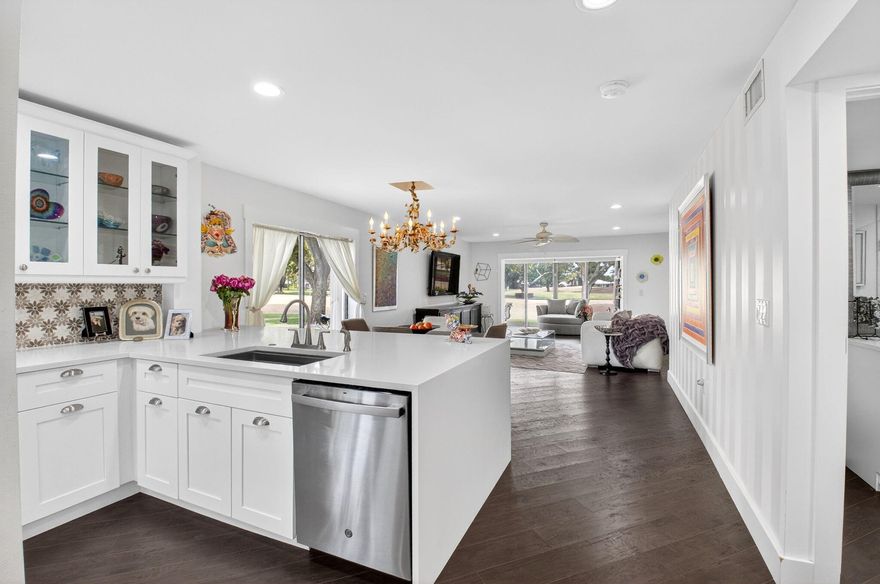 A rare jewel of Hunters Run should not be missed. On of a kind totally updated from A to Z; This beautifully renovated first-floor corner residence has been completely updated from top to bottom with exceptional attention to detail. This 2-bedroom, 2-bath home features a stunning modern kitchen with direct access to a spacious side patio through sliding glass doors--perfect for indoor-outdoor living. The expansive floor plan flows seamlessly into a large enclosed Florida room, ideal for a home office, lounge, or additional living space. The luxurious primary suite offers premium upgrades, including a soaking tub and an elegant walk-in shower, while the guest bedroom and full guest bath have also been tastefully redesigned. Don't miss your chance to own this gorgeous residence.