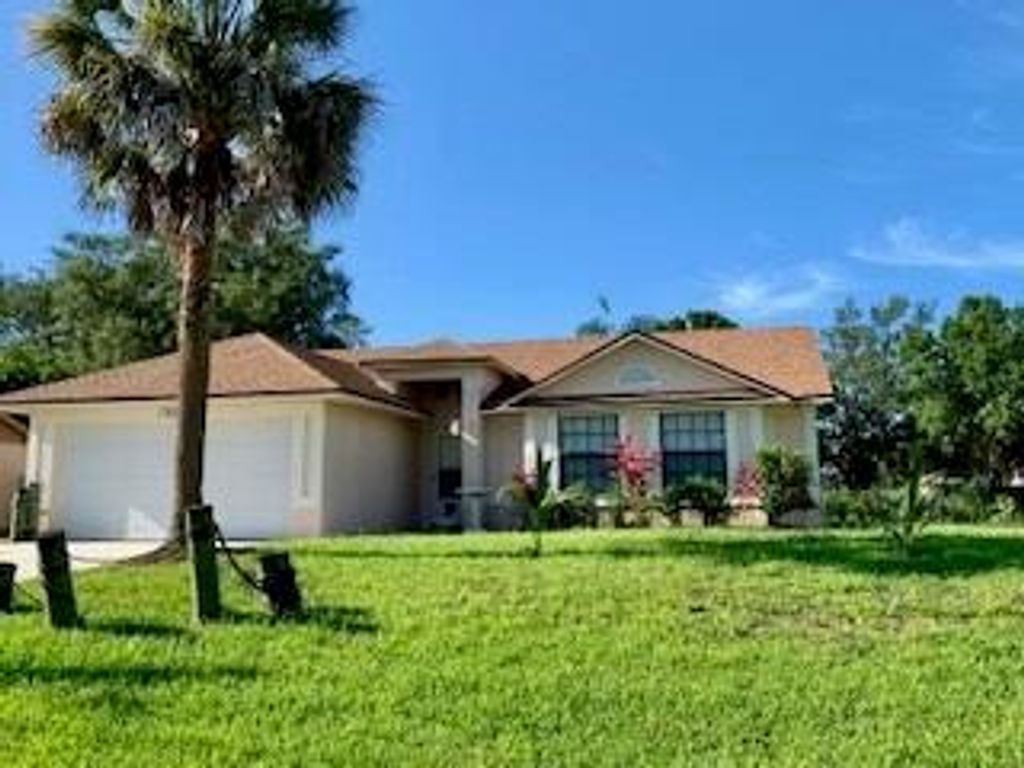 Photo of 1372 SW Sudder Avenue, Port Saint Lucie, FL 34953 (MLS # R10734314)