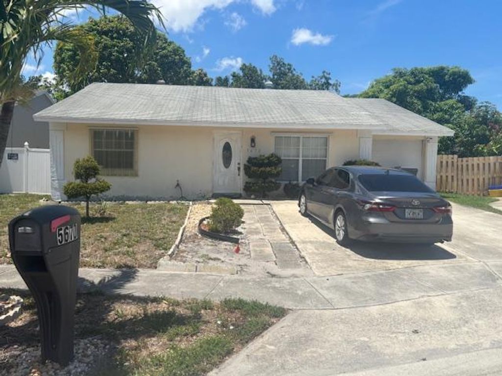 Photo of 5670 Ithaca Circle W, Greenacres, FL 33463 (MLS # R11102208)