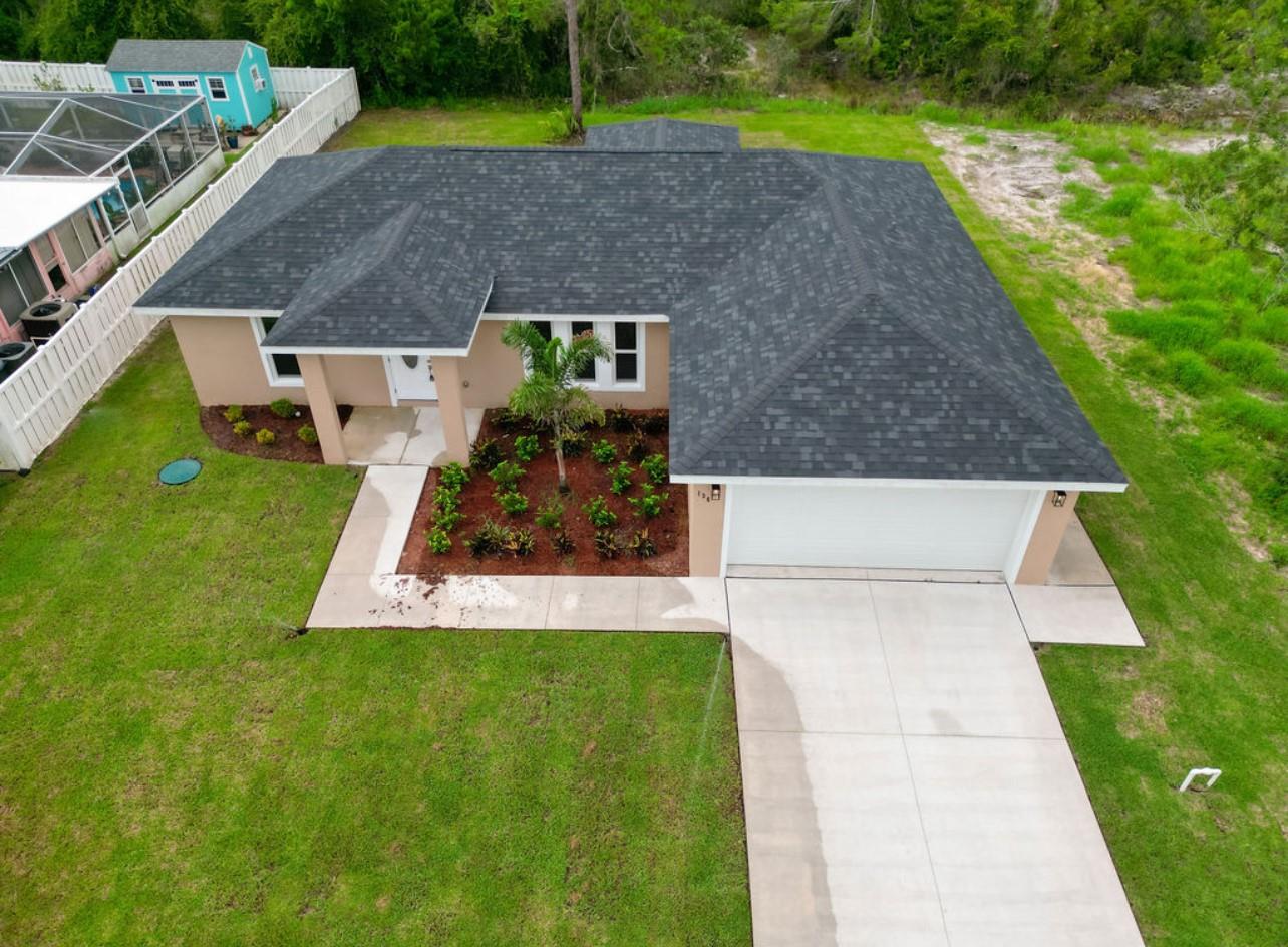 LEADING YOU HOME to a piece of paradise in beautiful Placid Lakes! Covered patio with this No flood zone area that situates this NEW CONSTRUCTION 3 bedrooms/2 baths and 2 car garage home with open concept floor plan & vaulted ceilings. kitchen boasts breakfast bar, stainless steel appliances and real wood cabinetry graced with the elegance of quartz counter spaces. The split floor plan for bedrooms. master has a large walk in closet and offers double sinks and large shower, floor to ceiling tile and frameless glass doors. Your new home offers luxury touches and high quality construction with IMPACT WINDOWS. covered lanai with no neighbors behind! The Placid Lakes golf course is right across the street and the private boat ramps and park for residents of Placid Lakes is just minutes away!