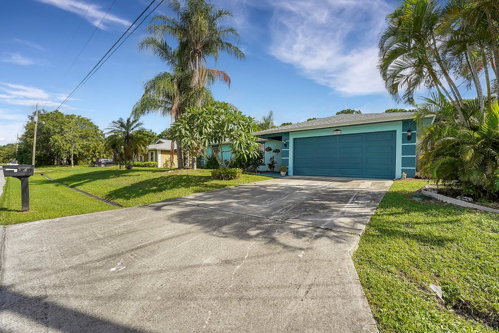 Photo of 1809 SW Oakwood Road, Port Saint Lucie, FL 34953 (MLS # R11007294)