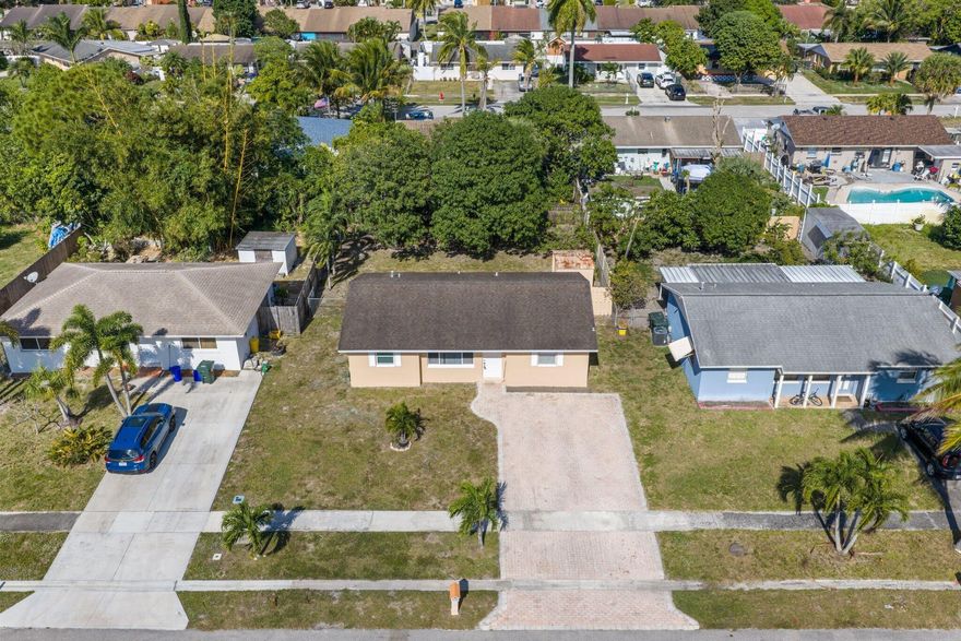 Welcome to this charming 3-bedroom, 1-bath home located in the desirable Lake Worth Hills community! Move-in ready and freshly updated, this property offers comfort, convenience, and incredible value with no HOA.Step inside to find all-new interior paint, creating a bright and modern feel throughout. The home also features new outlets and switches, along with new closet doors added in both the pantry and guest room for improved functionality and style. A brand-new front door adds to the home's clean aesthetic and welcoming curb appeal.Outside, enjoy fresh new exterior paint and a spacious backyard complete with a shed, perfect for extra storage or a workshop setup.Located in a prime central location with easy access to the Turnpike, this home offers quick connectivity to shopping,