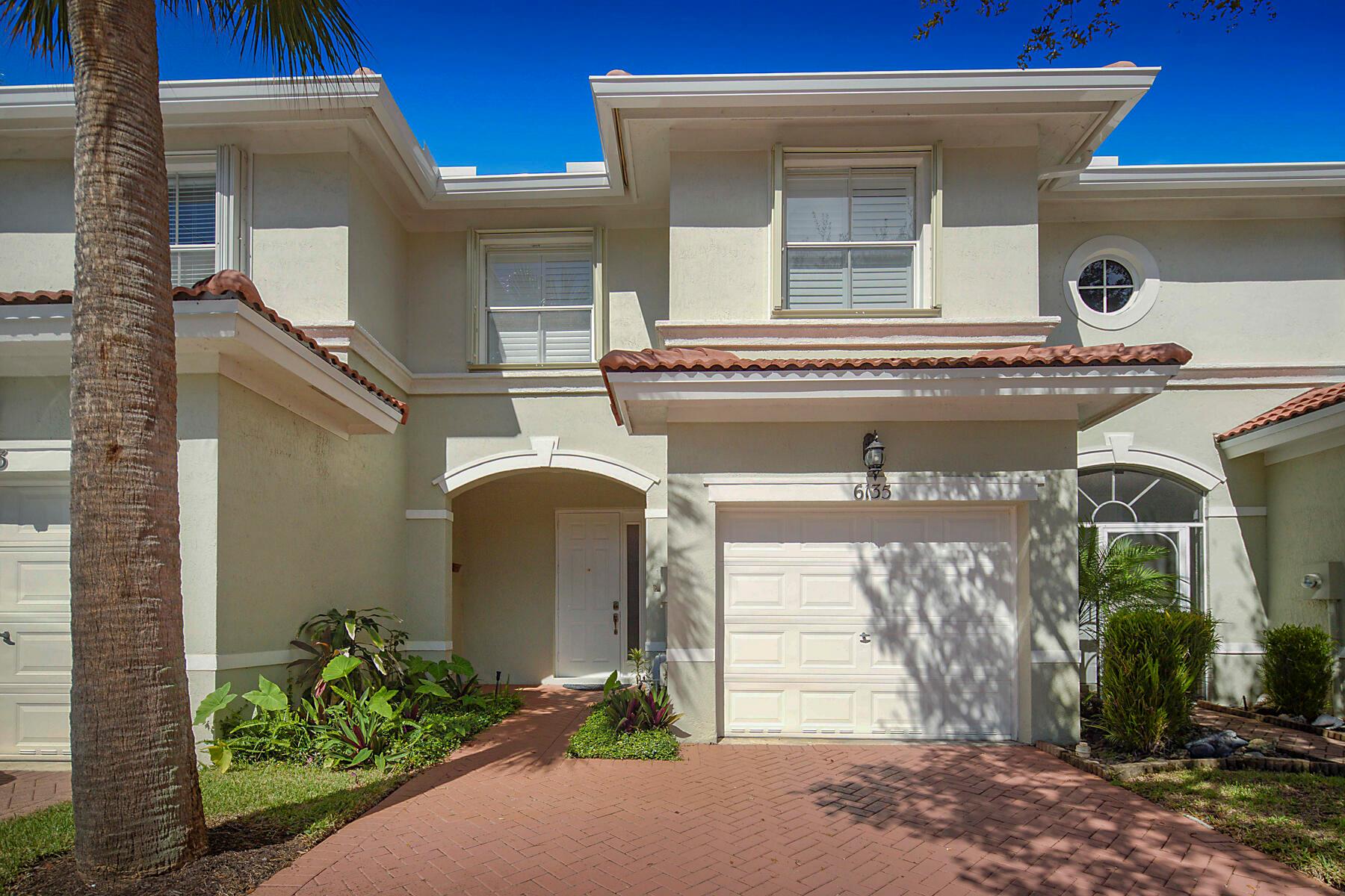 You will love the floor plan and upgraded features of this three bedroom, two and one half bath townhome in the gated community of Woodbine. Features include the New Roof, tile floors on the first floor with engineered flooring on the second floor, plantation shutters throughout, covered screened patio with tropical views, primary bedroom with a cathedral ceiling and two walk-in closets, freshly painted interior, white kitchen cabinets with uplighting, granite counter tops and stainless steel appliances, one car garage with a storage shelf, extra storage under the stairs, and the HD TV in the living room conveys. Meticulously maintained and ready for a new owner.