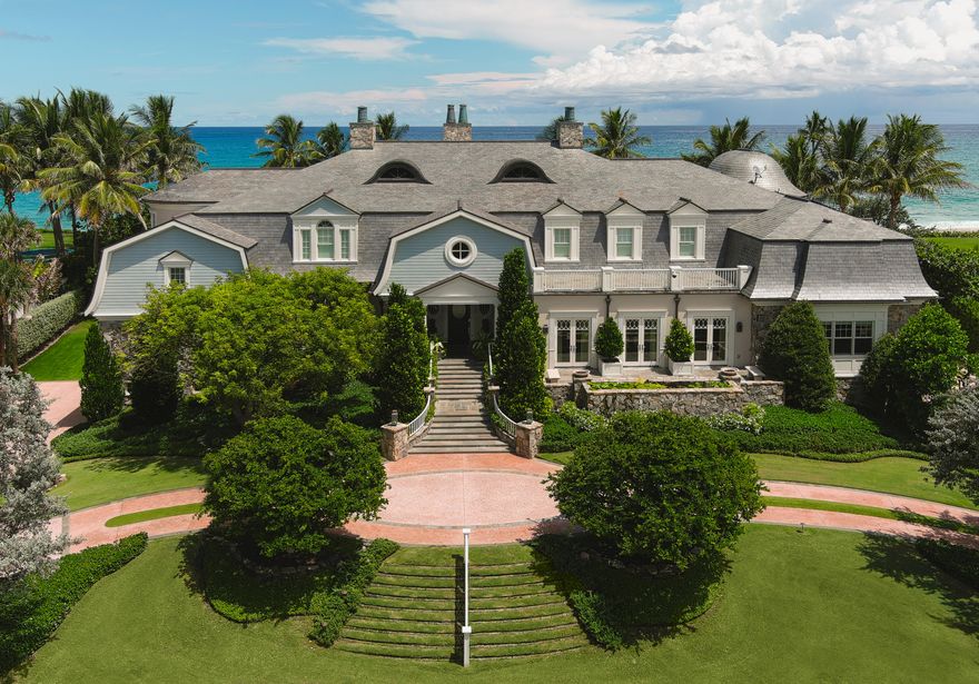 ''American Classic''
Private 200' of Wide, Protected Beachfront directly on the Atlantic Ocean-
An exclusive 1.4 acre oceanfront compound nestled in one of Palm Beaches most sought after communities, is a rare find. From the minute you arrive, entering through the circular paved motor-court, you are met with relaxing tropical breezes, lush landscaping and architectural grace.  Offered at $1,722 per square foot with 13,582 sqft living area and 18,871 sqft total area.
Built in 2009 this private residence's first floor features spectacular living spaces and dramatic ocean vistas highlighted by an expansive living room, dining room, family room, over-sized gourmet island kitchen with professional grade appliances, and master retreat, as well as his and her offices which could be additional bedrooms. The ground level includes: 5-car garage, cabana bath, powder room, mud room, game room, wine room, gift room, as well as staff bedroom, living room and bath.
The second floor boasts dramatic pool and ocean vistas featuring 5 additional large and nicely appointed bedrooms, 5 baths, plus study, 2-balconies and a grand sun-deck, serviced by a generous sized second-floor laundry and storage rooms.
Outdoors the sparkling over-sized pool and cabana are the focal point and gathering area for family and friends. The Mediterranean design is echoed in it's every detail, from the designers soft exterior pastels highlighted by white French windows and doors to the contrasting rooftop with the patina-copper chimney tops. The sundial spirited pergola wrapping the summer-kitchen loggia complete the architectural detail. A blending together of warm rays of sunshine and cool ocean breezes. Complete with a gymnasium, massage room and Tiki hut.