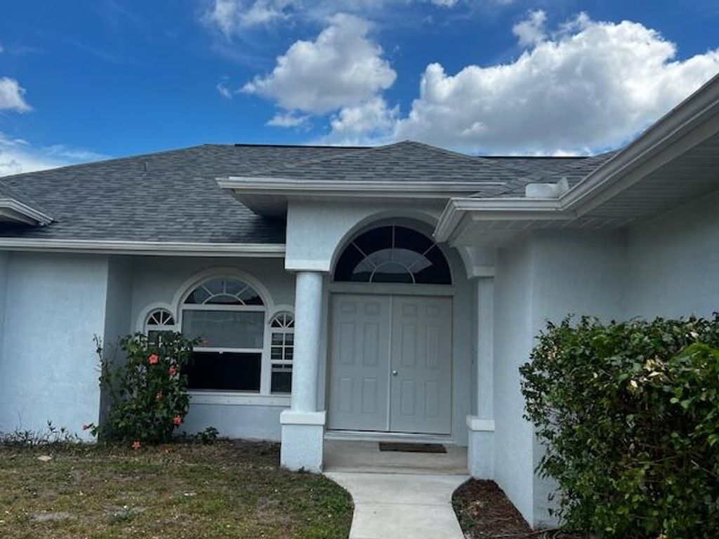 Photo of 1969 SW Gold Lane, Port Saint Lucie, FL 34953 (MLS # R10975344)