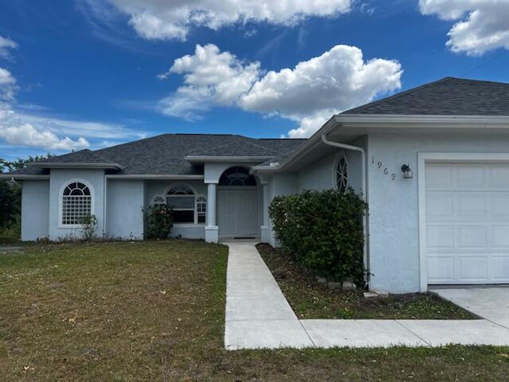 Photo of 1969 SW Gold Lane, Port Saint Lucie, FL 34953 (MLS # R10975344)