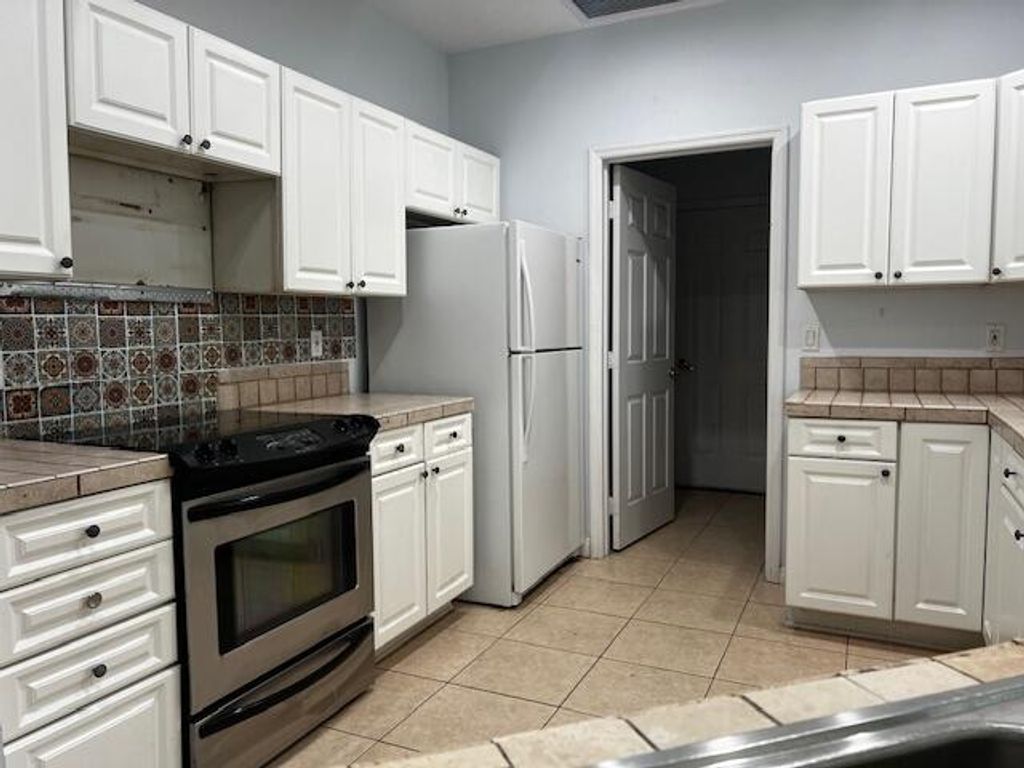 Photo of 1969 SW Gold Lane, Port Saint Lucie, FL 34953 (MLS # R10975344)